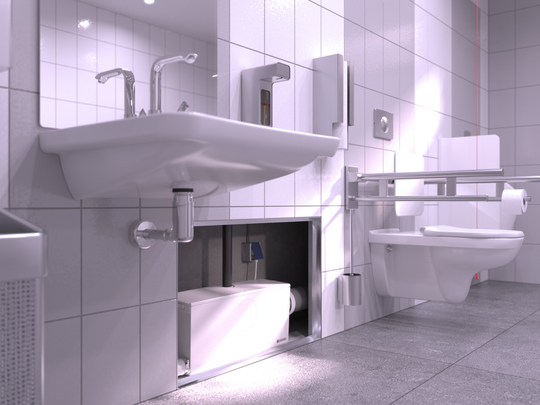 Primo piano di una piccola stazione di sollevamento installata nella parete divisoria, con WC e lavabo collegati.