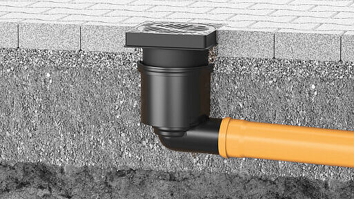 Scarico per cortile integrato in una superficie pavimentata Scarico per cortile integrato in una superficie pavimentata