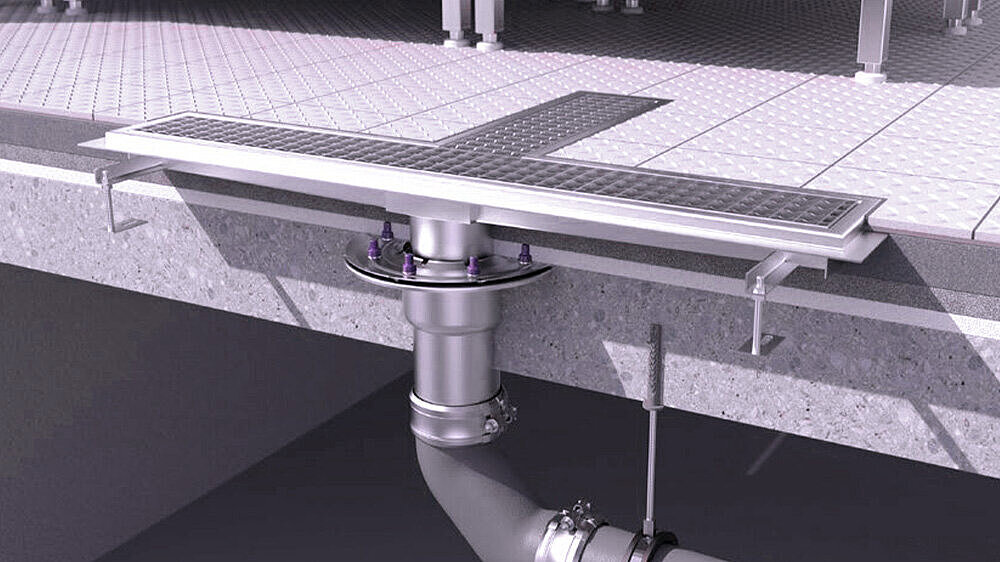 [Translate to Italienisch (IT):] Entwässerungsrinne aus Edelstahl in einer Küche.